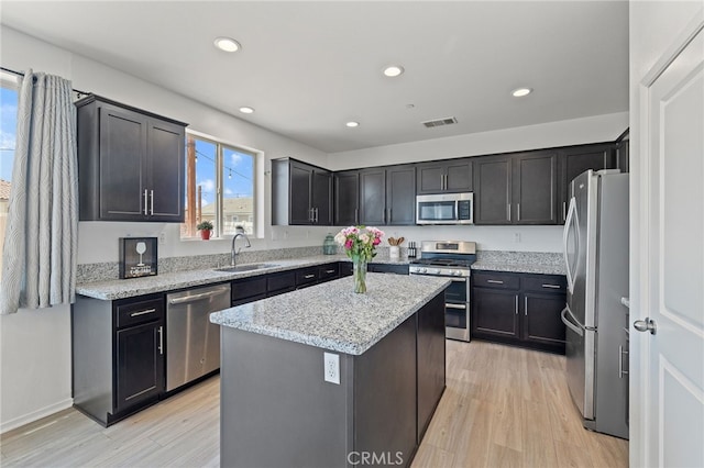 1415 Opal Ct, Beaumont, CA 92223 - kitchen with appliances with stainless steel finishes, healthy amount of natural light, light wood-style floors, and recessed lighting