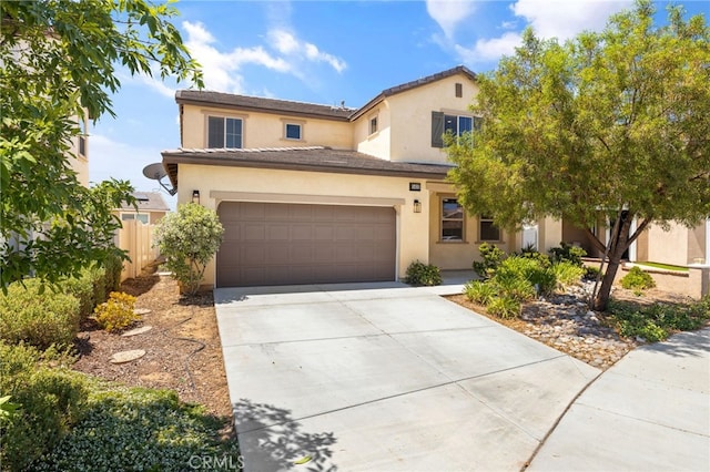 1415 Opal Ct, Beaumont, CA 92223 - view of front of house featuring concrete driveway, stucco siding, an attached garage, and a tiled roof
