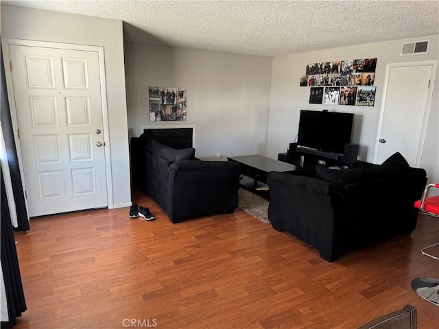 1549 W 146th St Unit 9, Gardena, CA 90247 - living room with wood finished floors and a textured ceiling