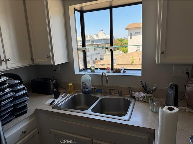 1549 W 146th St Unit 9, Gardena, CA 90247 - kitchen with a sink and white cabinets