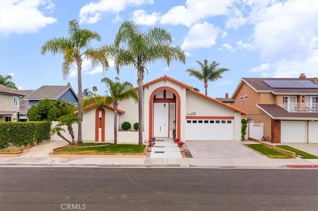 21211 Poston Ln, Huntington Beach, CA 92646 - view of front of property with driveway and stucco siding