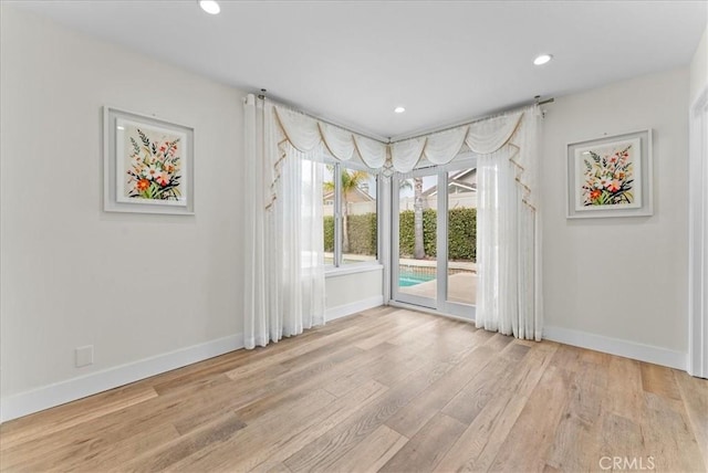 21211 Poston Ln, Huntington Beach, CA 92646 - unfurnished room with light wood-type flooring and recessed lighting
