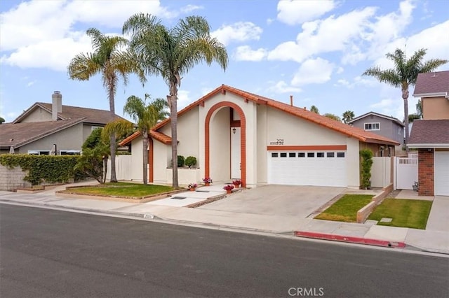 21211 Poston Ln, Huntington Beach, CA 92646 - view of front facade with an attached garage, stucco siding, and concrete driveway