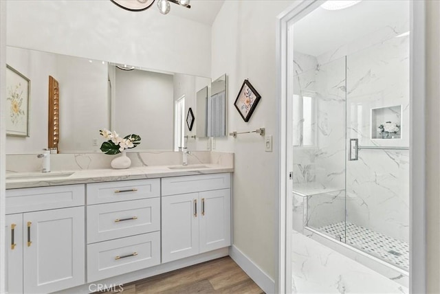 21211 Poston Ln, Huntington Beach, CA 92646 - full bathroom with a marble finish shower, double vanity, and wood finished floors