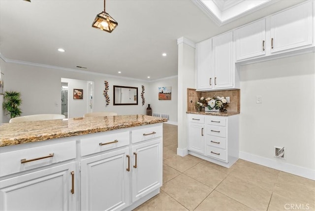 21211 Poston Ln, Huntington Beach, CA 92646 - kitchen featuring decorative backsplash, white cabinets, crown molding, light stone counters, and light tile patterned flooring