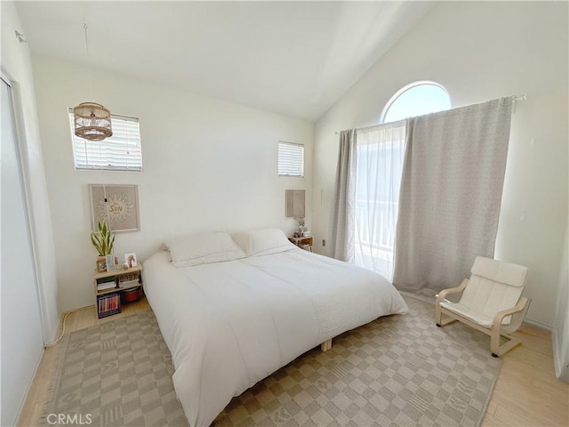 8655 Moody St, Cypress, CA 90630 - bedroom with lofted ceiling and wood finished floors