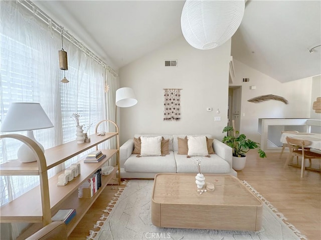 8655 Moody St, Cypress, CA 90630 - living area with lofted ceiling and wood finished floors