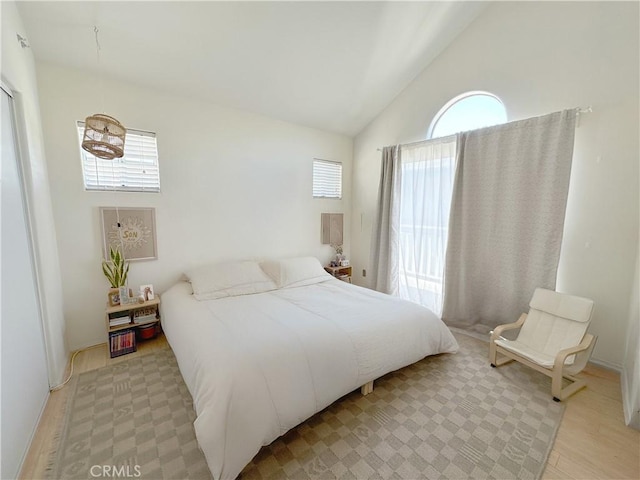 8655 Moody St, Cypress, CA 90630 - bedroom with light wood-style floors and high vaulted ceiling