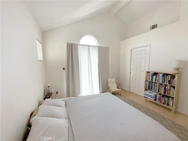 8655 Moody St, Cypress, CA 90630 - bedroom featuring beamed ceiling, high vaulted ceiling, and wood finished floors