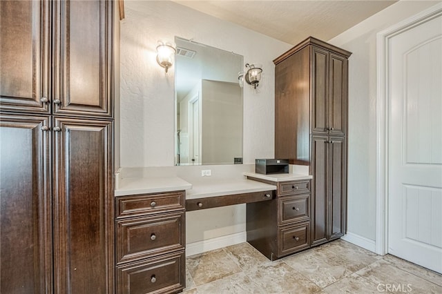 6626 W Alluvial Ave, Fresno, CA 93722 - bathroom with vanity and baseboards