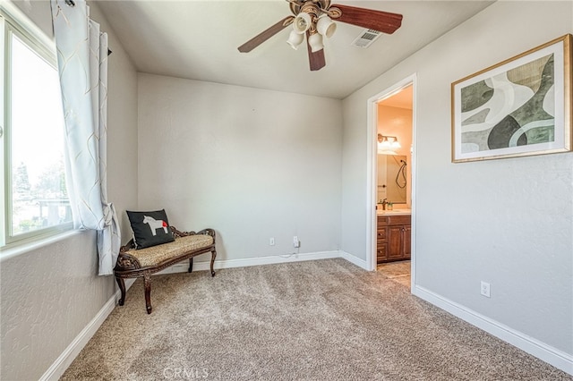 6626 W Alluvial Ave, Fresno, CA 93722 - sitting room with ceiling fan and light colored carpet