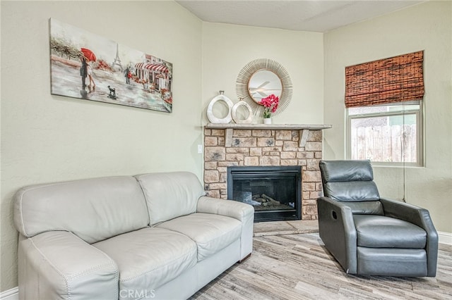 6626 W Alluvial Ave, Fresno, CA 93722 - living area featuring wood finished floors and a fireplace