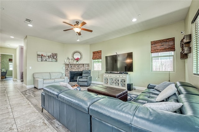 6626 W Alluvial Ave, Fresno, CA 93722 - living area with ceiling fan, healthy amount of natural light, recessed lighting, and a fireplace