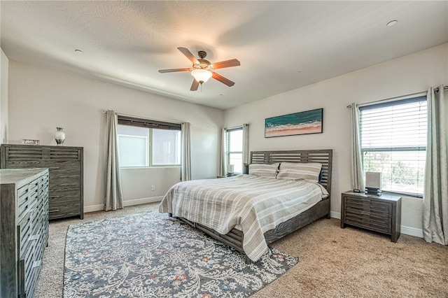 6626 W Alluvial Ave, Fresno, CA 93722 - bedroom featuring light carpet and a ceiling fan