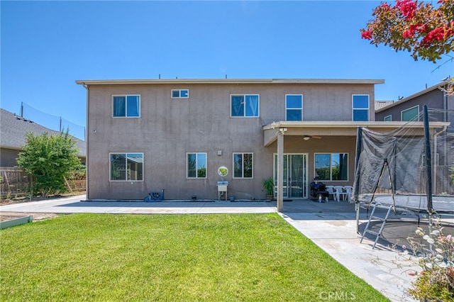 6626 W Alluvial Ave, Fresno, CA 93722 - rear view of house featuring a patio area and stucco siding