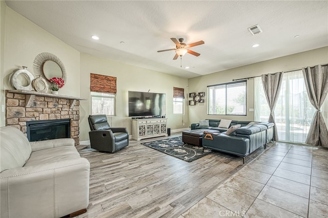 6626 W Alluvial Ave, Fresno, CA 93722 - living area with a ceiling fan, plenty of natural light, a fireplace, recessed lighting, and wood finished floors