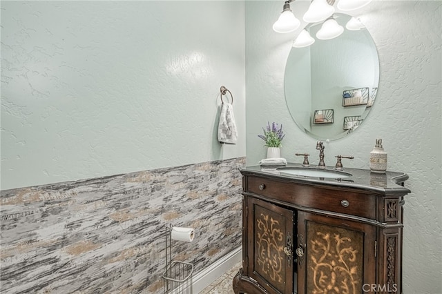 6626 W Alluvial Ave, Fresno, CA 93722 - bathroom with a chandelier and vanity