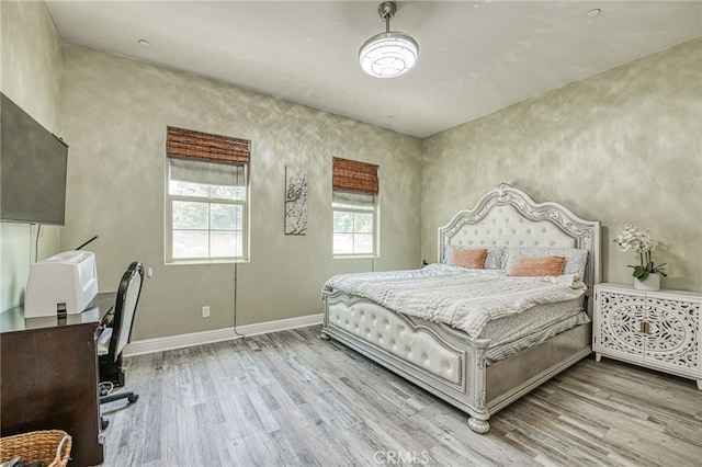 6626 W Alluvial Ave, Fresno, CA 93722 - bedroom featuring wood finished floors and an office area