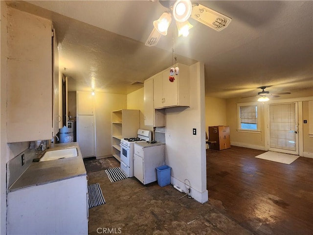 4317 Lugo Ave, Chino Hills, CA 91709 - kitchen featuring white range with gas stovetop, a ceiling fan, and white cabinets