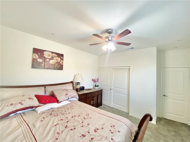 1011 Balsam St, Calimesa, CA 92320 - bedroom with light colored carpet, a closet, and a ceiling fan