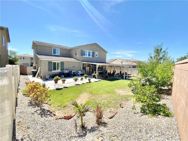 1011 Balsam St, Calimesa, CA 92320 - back of house with stucco siding, a fenced backyard, and a patio area