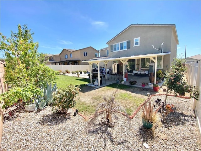 1011 Balsam St, Calimesa, CA 92320 - back of house featuring a fenced backyard, a patio, and stucco siding