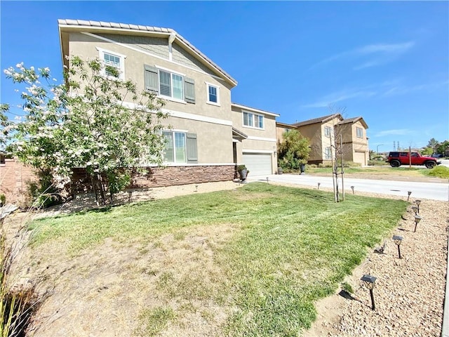 1011 Balsam St, Calimesa, CA 92320 - view of front facade with stucco siding, an attached garage, driveway, and a front yard