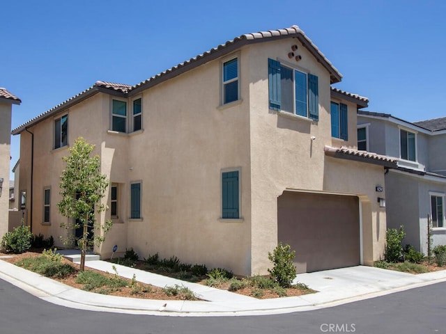 29425 Bovenzi Way, Winchester, CA 92596 - view of front of property with an attached garage, stucco siding, and a tile roof