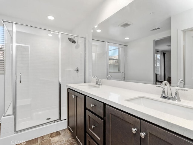 29425 Bovenzi Way, Winchester, CA 92596 - bathroom with a shower stall, double vanity, and recessed lighting