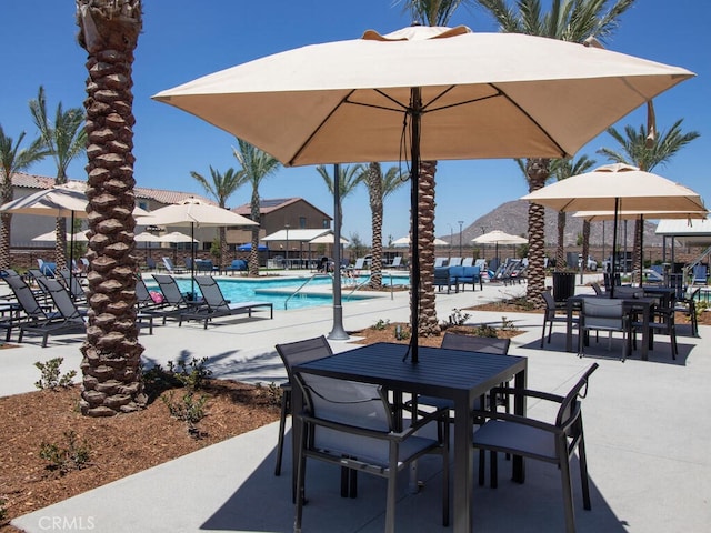 29425 Bovenzi Way, Winchester, CA 92596 - view of patio / terrace featuring a community pool and outdoor dining area