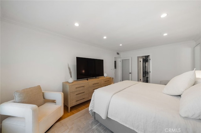 3407 Huxley St Unit 31, Los Angeles, CA 90027 - bedroom featuring light wood finished floors, crown molding, recessed lighting, and a spacious closet