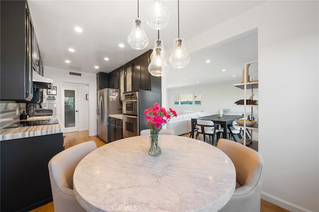 3407 Huxley St Unit 31, Los Angeles, CA 90027 - dining room with recessed lighting and light wood-style flooring