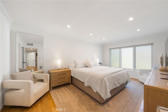 3407 Huxley St Unit 31, Los Angeles, CA 90027 - bedroom with crown molding, light wood-style floors, and recessed lighting