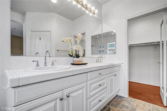 2019 Arnold Way, Fullerton, CA 92833 - bathroom featuring double vanity and a spacious closet
