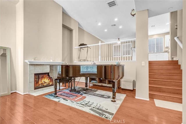 2019 Arnold Way, Fullerton, CA 92833 - sitting room featuring wood finished floors, stairs, a fireplace, and a high ceiling