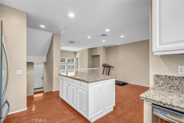 2019 Arnold Way, Fullerton, CA 92833 - kitchen featuring stainless steel dishwasher, white cabinetry, light wood-type flooring, fridge, and a kitchen island