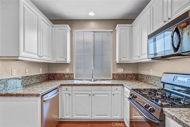 2019 Arnold Way, Fullerton, CA 92833 - kitchen featuring appliances with stainless steel finishes, white cabinetry, and light stone counters