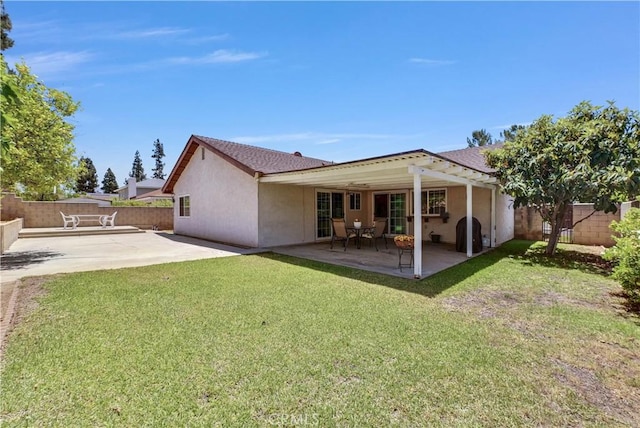 1135 Hampton Ct, San Dimas, CA 91773 - rear view of house featuring a fenced backyard, a patio area, and stucco siding