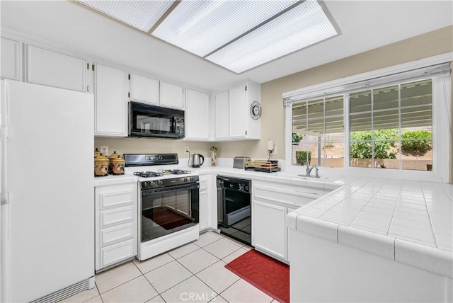 1135 Hampton Ct, San Dimas, CA 91773 - kitchen featuring black appliances, tile countertops, white cabinets, and light tile patterned flooring