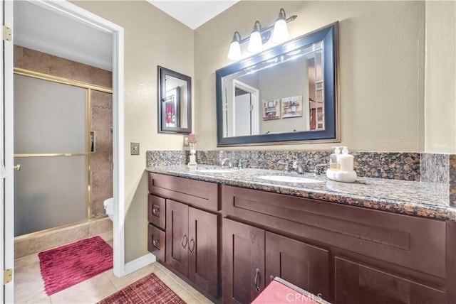1135 Hampton Ct, San Dimas, CA 91773 - full bath with double vanity, a shower stall, and tile patterned flooring