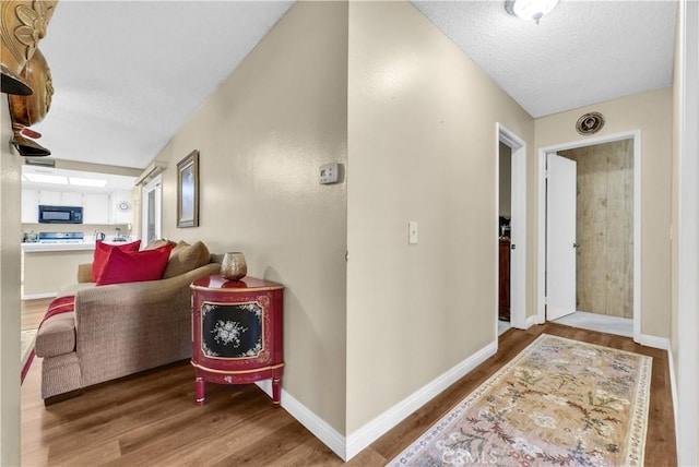 1135 Hampton Ct, San Dimas, CA 91773 - corridor featuring wood finished floors and a textured ceiling