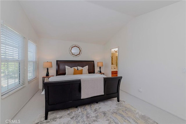 15034 Ocaso Ave, La Mirada, CA 90638 - bedroom featuring vaulted ceiling, light carpet, and ensuite bath