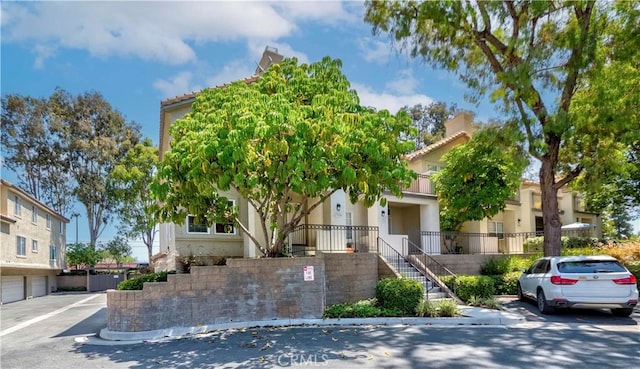 15034 Ocaso Ave, La Mirada, CA 90638 - view of front facade featuring stucco siding and a residential view