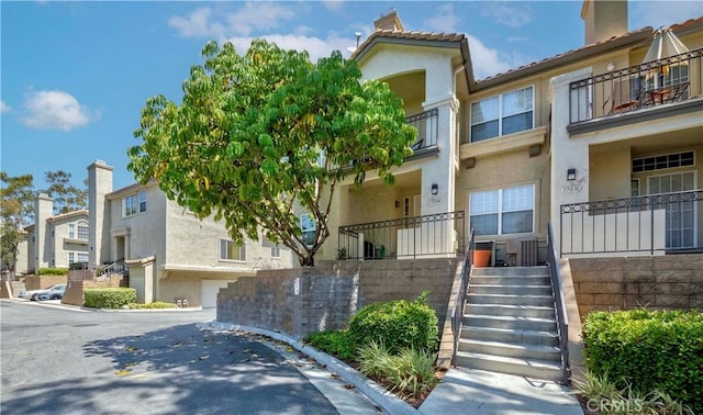 15034 Ocaso Ave, La Mirada, CA 90638 - view of property featuring stairs and a residential view