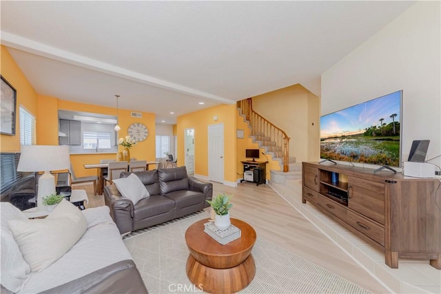 15034 Ocaso Ave, La Mirada, CA 90638 - living area featuring stairs, light wood-style flooring, and recessed lighting