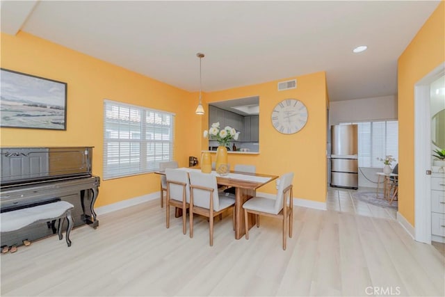 15034 Ocaso Ave, La Mirada, CA 90638 - dining room featuring light wood finished floors and recessed lighting