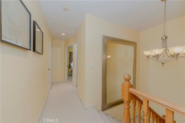 15034 Ocaso Ave, La Mirada, CA 90638 - hallway with an upstairs landing, light colored carpet, a chandelier, and recessed lighting