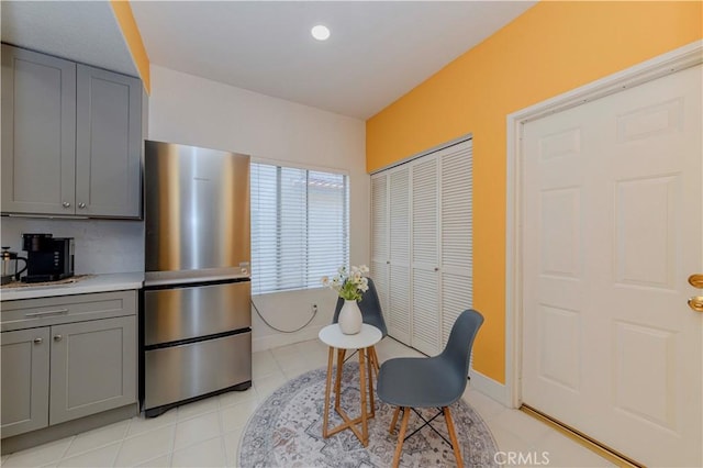 15034 Ocaso Ave, La Mirada, CA 90638 - kitchen with gray cabinets, freestanding refrigerator, light countertops, light tile patterned floors, and recessed lighting