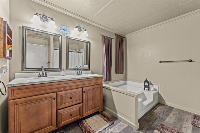 41050 Mohawk Cir, Cherry Valley, CA 92223 - bathroom featuring double vanity, a garden tub, crown molding, and wood finished floors