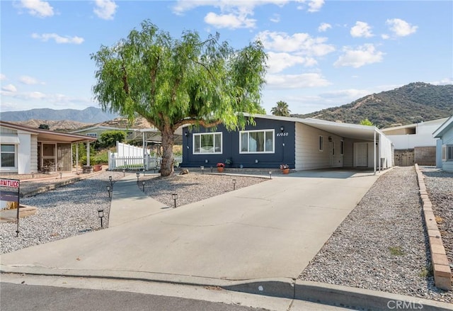41050 Mohawk Cir, Cherry Valley, CA 92223 - view of front of property with a mountain view, concrete driveway, and an attached carport